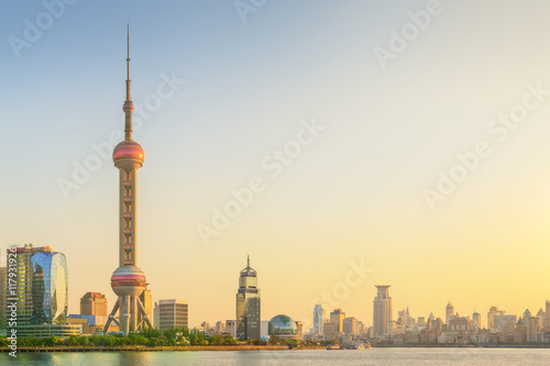Cityscape of Shanghai and Huangpu River on sunset, beautiful reflection on skyscrapers, China