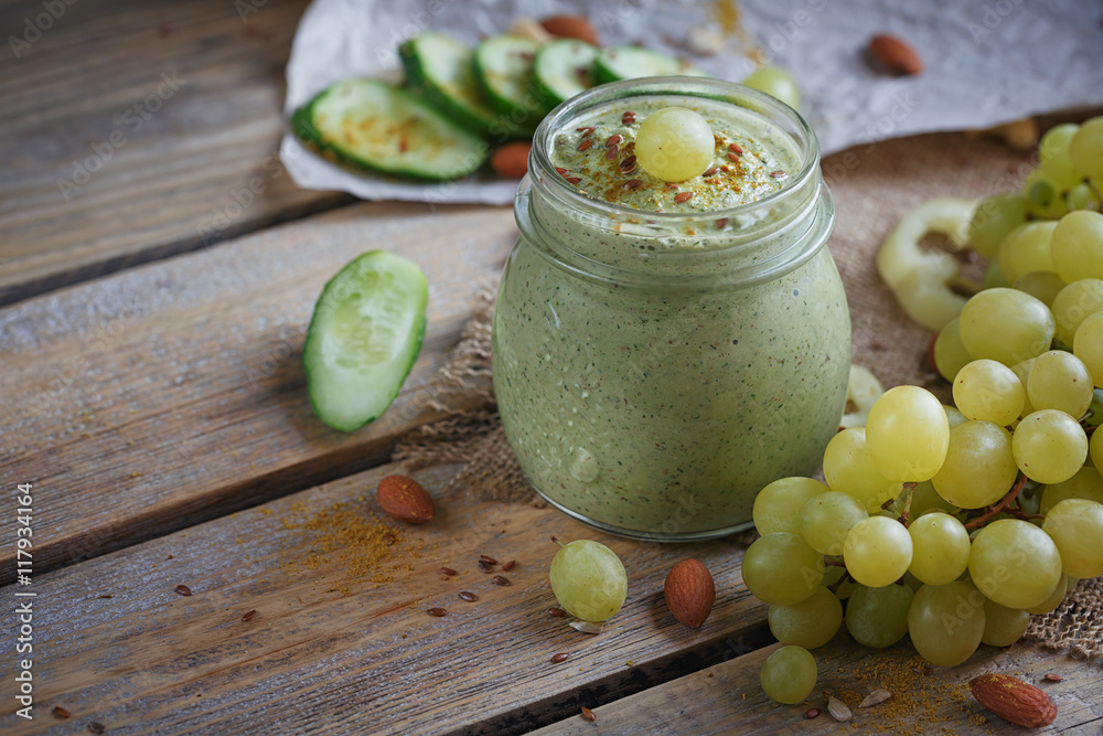 Fresh organic green smoothie with cucumber, parsley, grapes and Fresh organic green smoothie with cucumber, parsley, grapes and