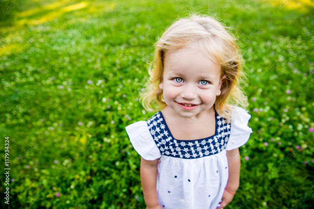 Little girl walking in the park Little girl walking in the park