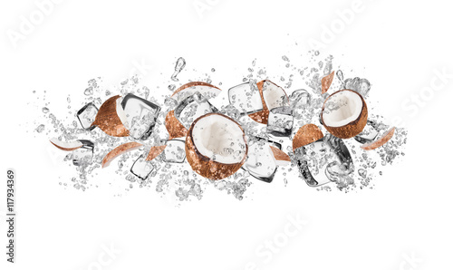 Coconuts in water splash on white background