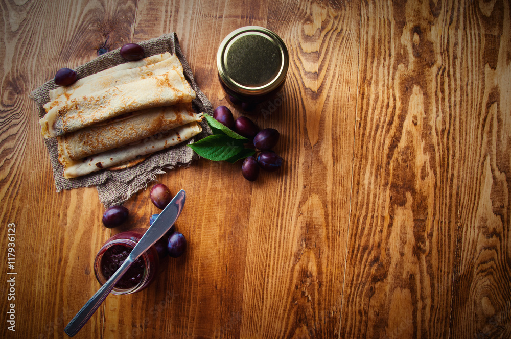 Pancakes and fresh plum jam with text space Pancakes and fresh plum jam with text space