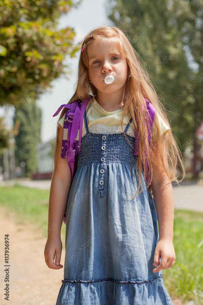 funny girl blowing bubble from chewing gum funny girl blowing bubble from chewing gum
