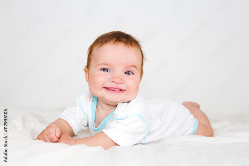 Funny little baby lying down on a blanket . Newborn child relaxing in bed. Nursery for young children. Textile and bedding for kids.
Funny little baby lying down on a blanket . Newborn child relaxing in bed. Nursery for young children. Textile and bedding for kids.