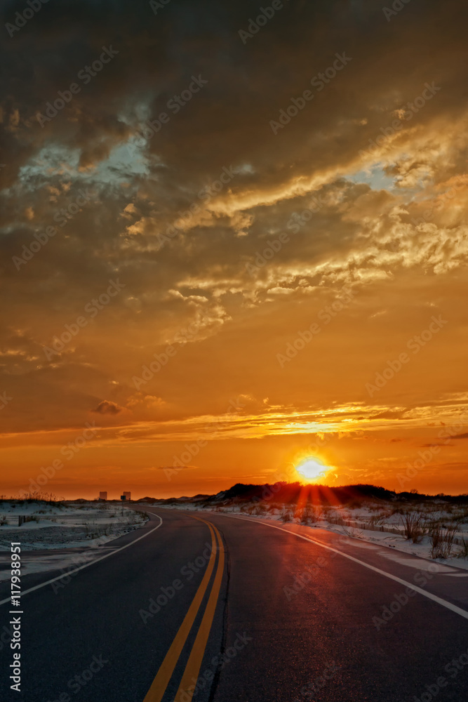 Sunset drive through Gulf Island National Seashore toward Pensacola Beach, Florida.