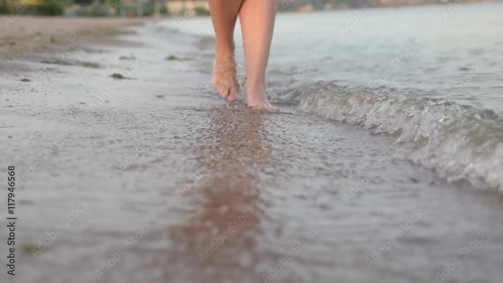a girl keeps along the shore on water womanish feet a girl keeps along the shore on water womanish feet