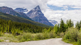 Canada Banff national park with chairs andfoggy mountains and forest.