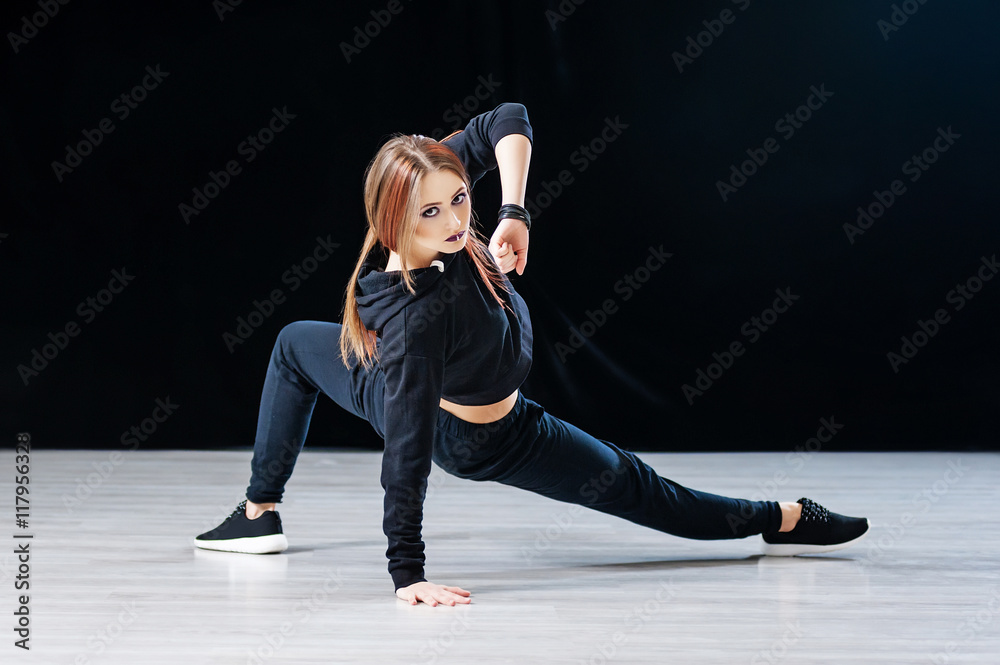 Hip-hop dancer posing in dance studio