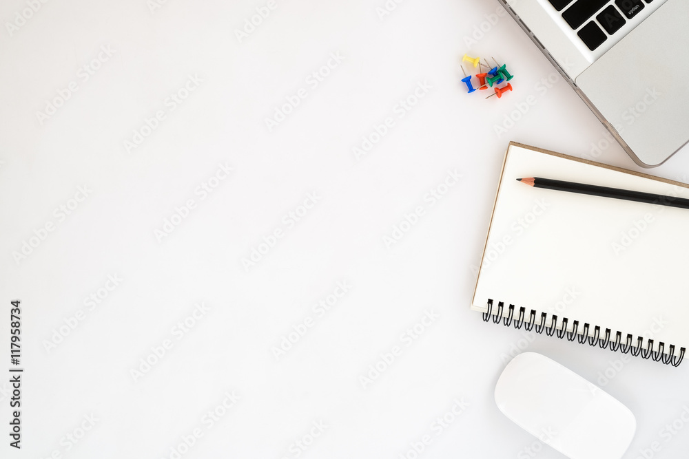 White office workspace with blank leather notebook ,pencil, mouse and laptop. Top view with copy space White office workspace with blank leather notebook ,pencil, mouse and laptop. Top view with copy space