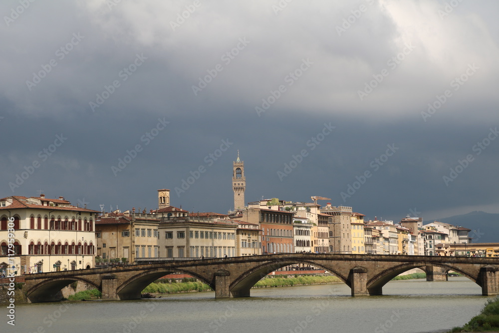 Storm clouds over Ponte alla Carraia and River Arno, Florence Italy