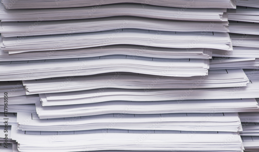A stack of papers on desk
