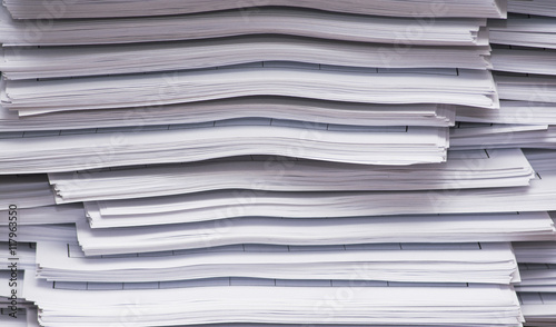 A stack of papers on desk