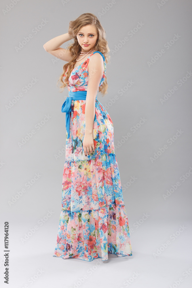 Beautiful young woman in a long dress color. Beautiful young woman in a long dress color.