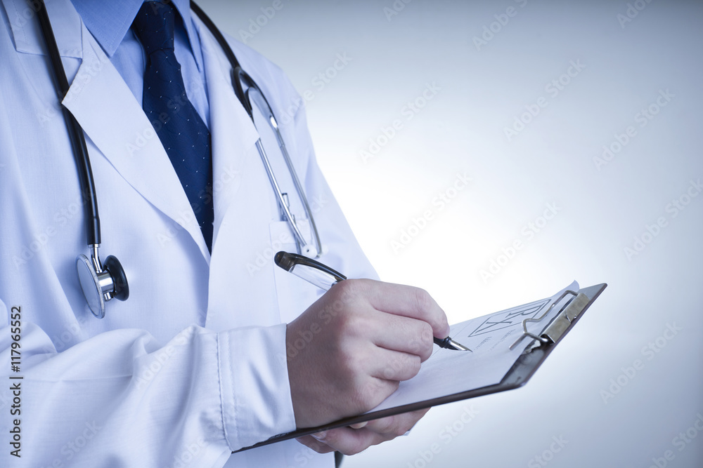 Doctor writing a medical prescription Doctor writing a medical prescription