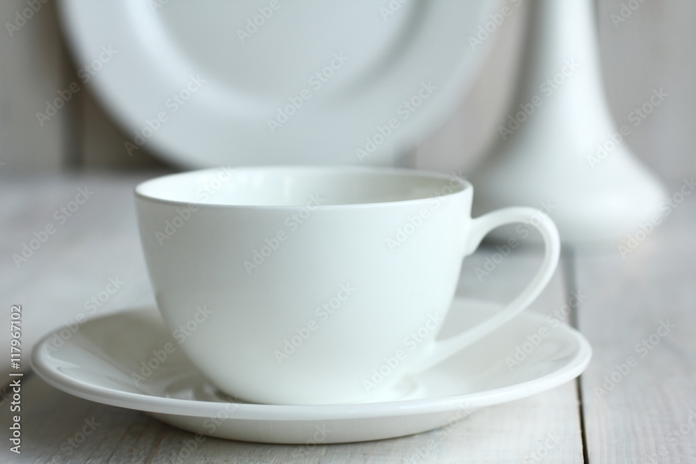 the Cup and saucer on wooden background.Monochrome