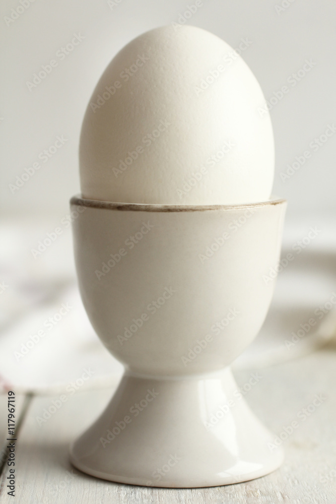 egg on wooden background.Monochrome egg on wooden background.Monochrome