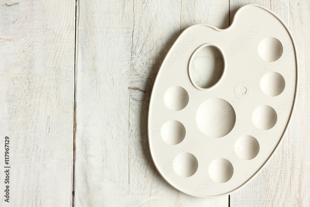 palette on wooden background.Monochrome palette on wooden background.Monochrome