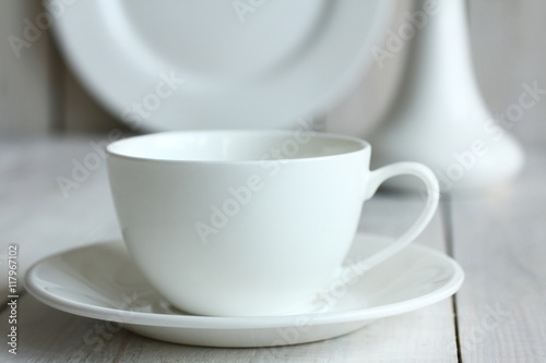 the Cup and saucer on wooden background.Monochrome