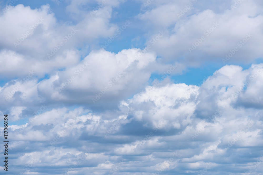 Fototapeta premium Beautiful cloudscape over horizon. Blue sky and clouds. Natural cloudscape background.