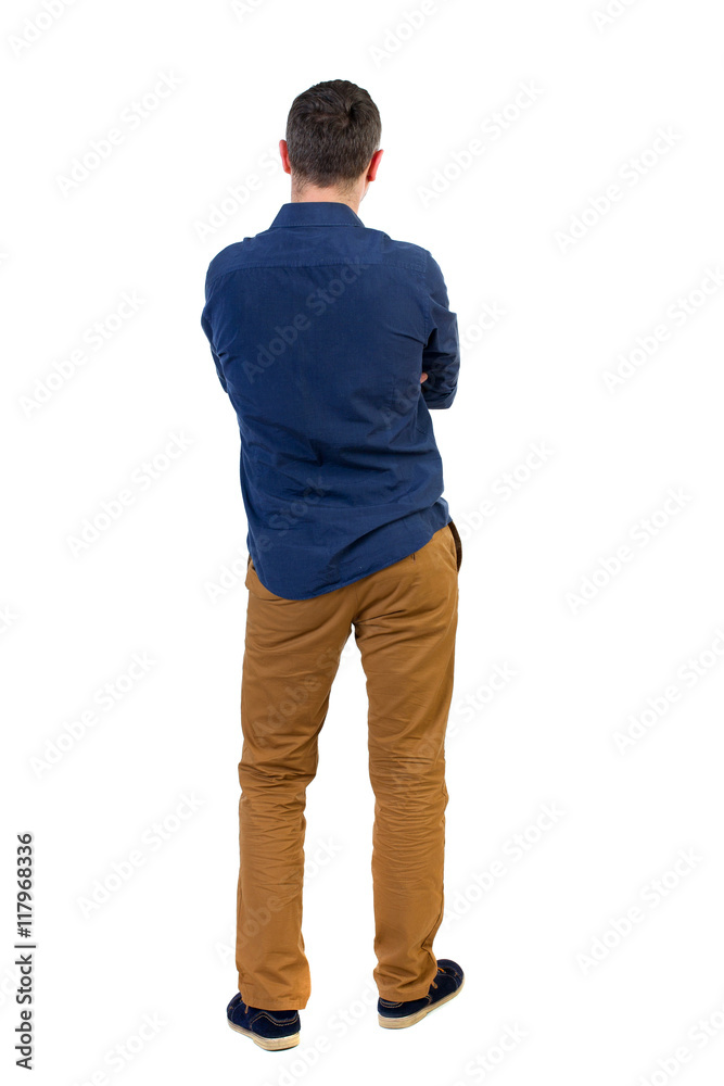 Back view of man . Standing young guy. Rear view people collection. backside view of person. Isolated over white background.a man in a blue shirt with the sleeves rolled up, standing with her hands Back view of man . Standing young guy. Rear view people collection. backside view of person. Isolated over white background.a man in a blue shirt with the sleeves rolled up, standing with her hands
