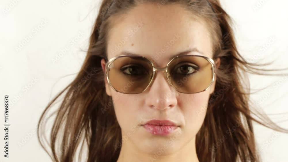 pretty woman wearing different retro sunglasses pretty woman wearing different retro sunglasses