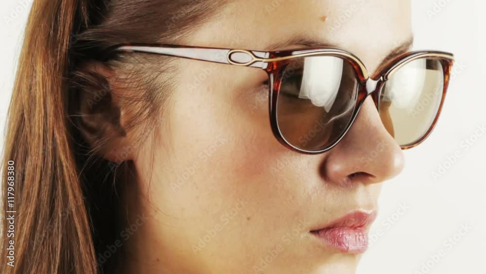 pretty woman wearing different retro sunglasses pretty woman wearing different retro sunglasses