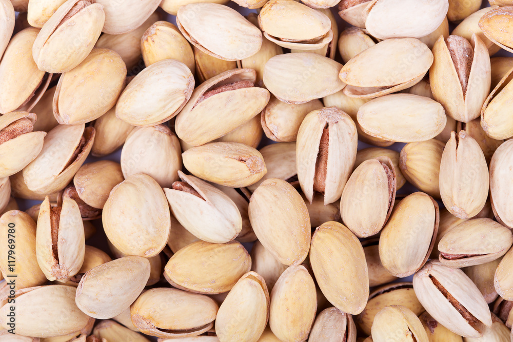 Abstract background of salted pistachios. Top view