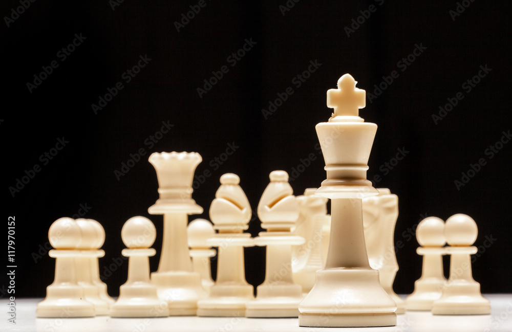 chess pieces on a black background