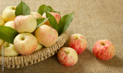 ripe apples in a beautiful wicker basket