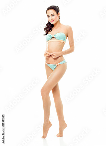 Sexy young brunette woman posing in a bikini.Beautiful perfect f
