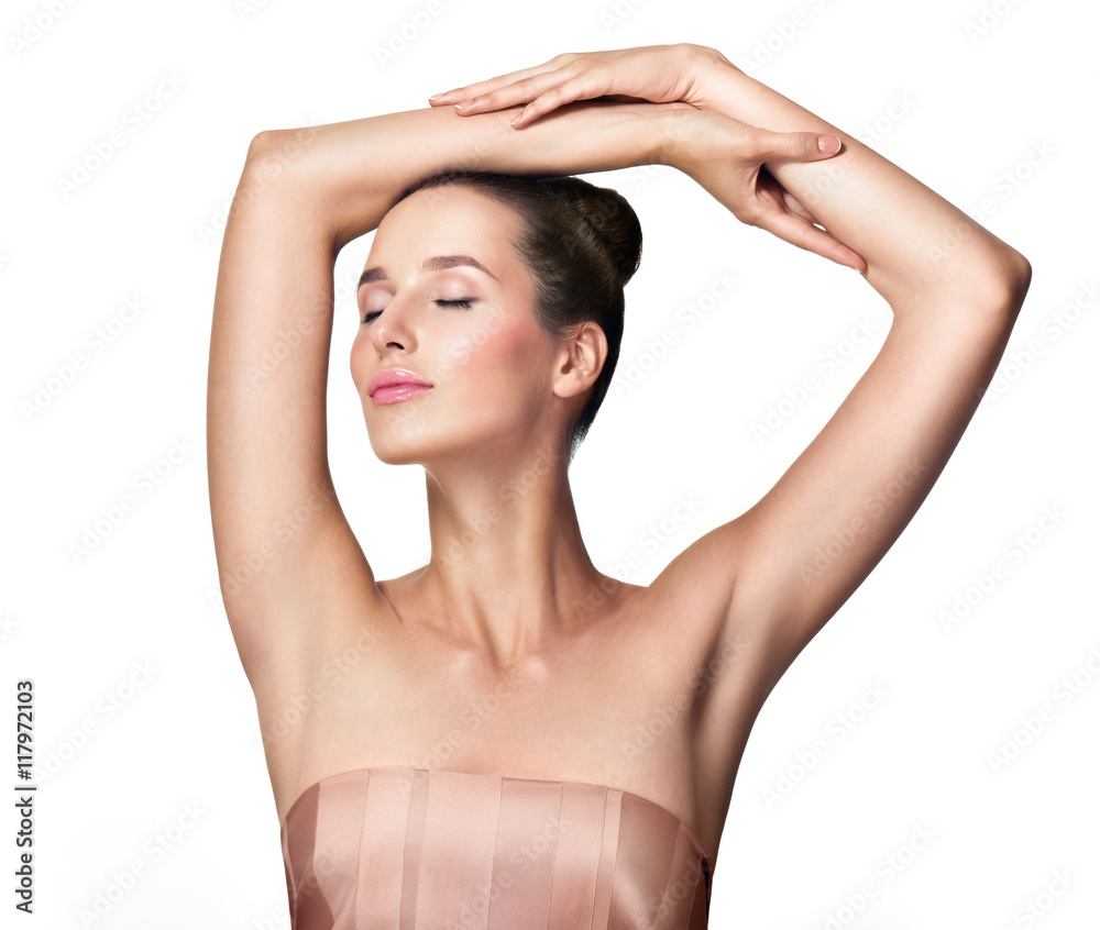 Beautiful young woman holding her arms up and showing clean unde Beautiful young woman holding her arms up and showing clean unde