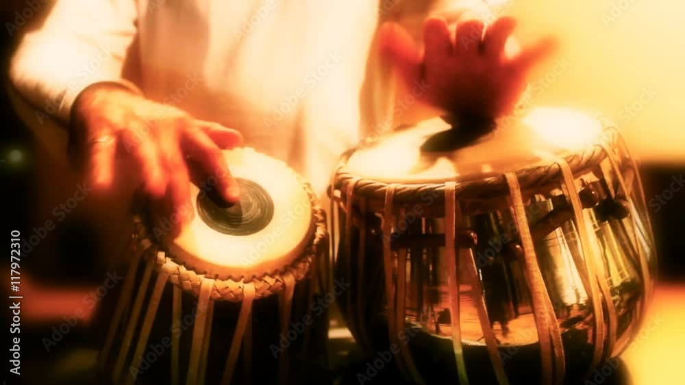Close-up of man playing the tabla drum