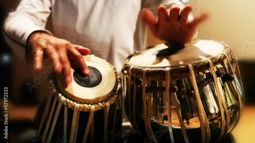 Close-up of man playing the tabla drum