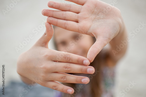 girl showing hand gestures