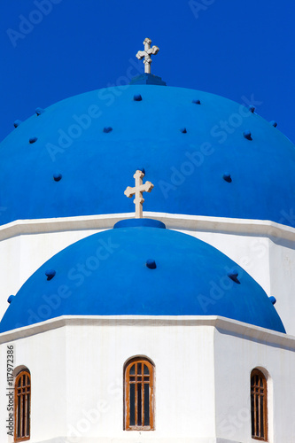 Blue domes of the Church of the holy cross in Perissa, Santorini. 