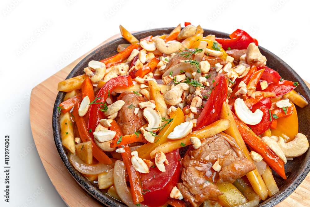 Isolated chicken with vegetable on frying pan Isolated chicken with vegetable on frying pan