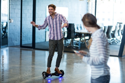 Photography Graphic designer standing on hoverboard