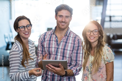 Business colleagues using digital tablet in office photo