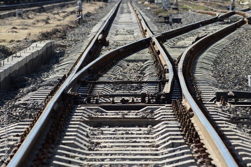 Railroad tracks at the train station photo