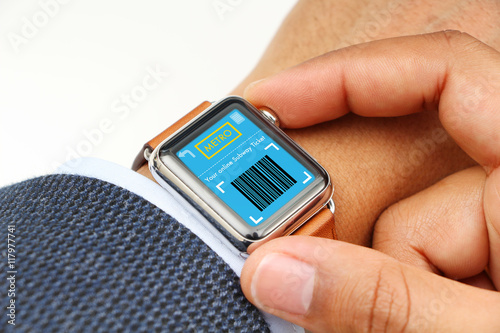 Businessman buying subway ticket through a smart watch app