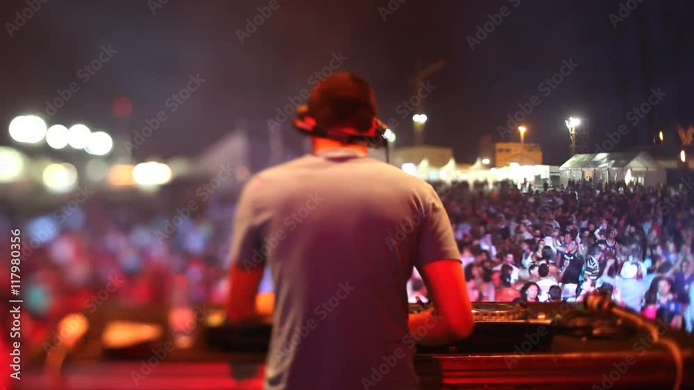 dj looking the crowd at a festival