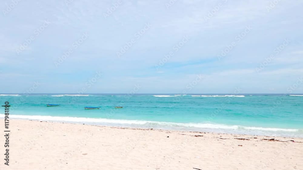 Paradise Beach. Waves at the beach . Ocean. Sea. Summer. Bali. White sand . Sunny beach. Relax beach . Dream . Boats on the beach. Fishing boats. The waves of the sea. Paradise Beach. Waves at the beach . Ocean. Sea. Summer. Bali. White sand . Sunny beach. Relax beach . Dream . Boats on the beach. Fishing boats. The waves of the sea.