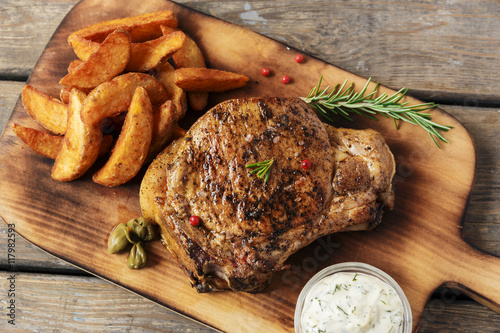 steak on the bone steak with baked potato and gravy