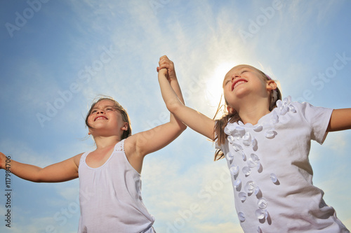 sister who having fun together outside