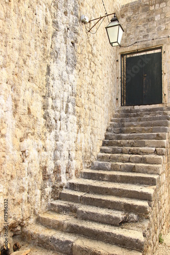 Fototapeta Naklejka Na Ścianę i Meble -  Old stairs and street lantern in Dubrovnik, Croatia