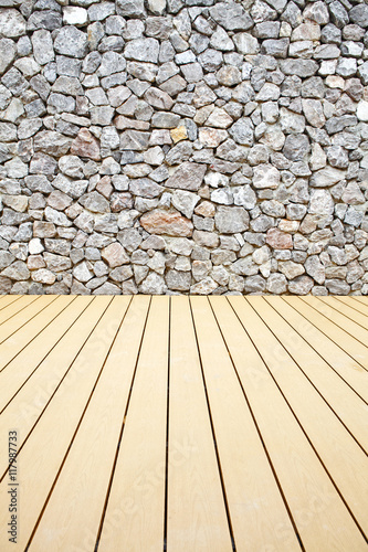 The rock walls and wooden floor.