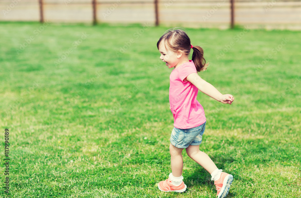 happy little girl running on green summer field happy little girl running on green summer field