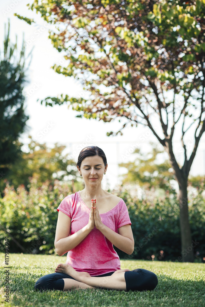 Young woman doing yoga and meditation, outside, eyes closed Young woman doing yoga and meditation, outside, eyes closed