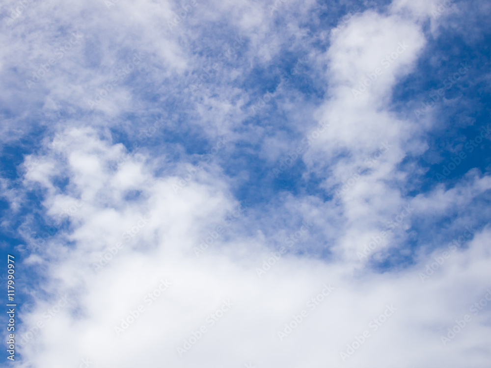 Clear blue sky with white cloud background