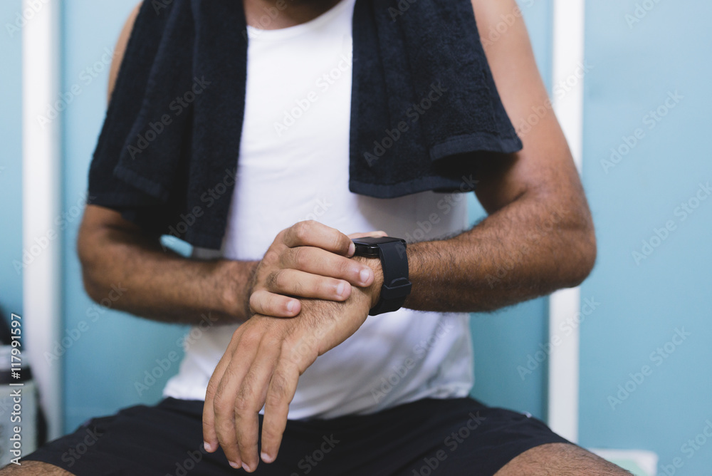 Close-up of athlete with smartwatch outdoors Close-up of athlete with smartwatch outdoors