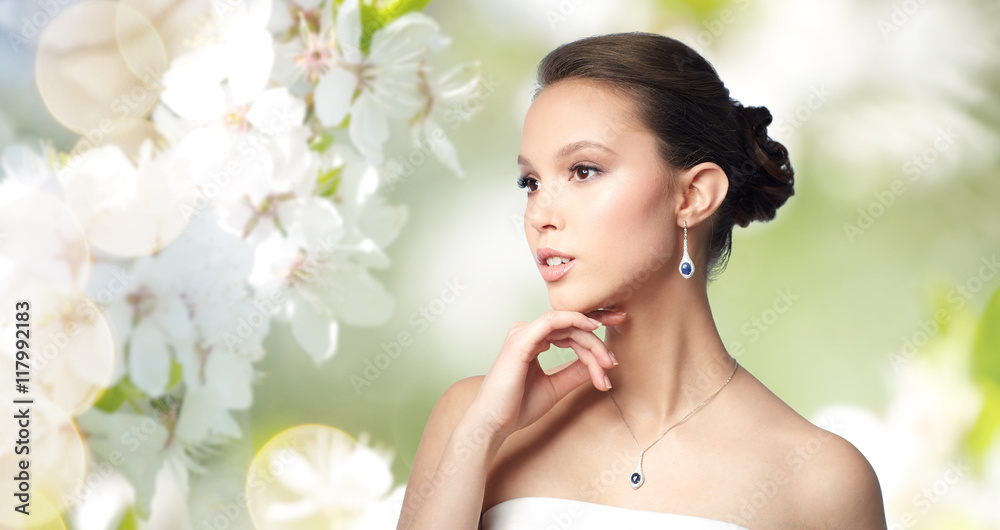 beautiful asian woman with earring and pendant beautiful asian woman with earring and pendant